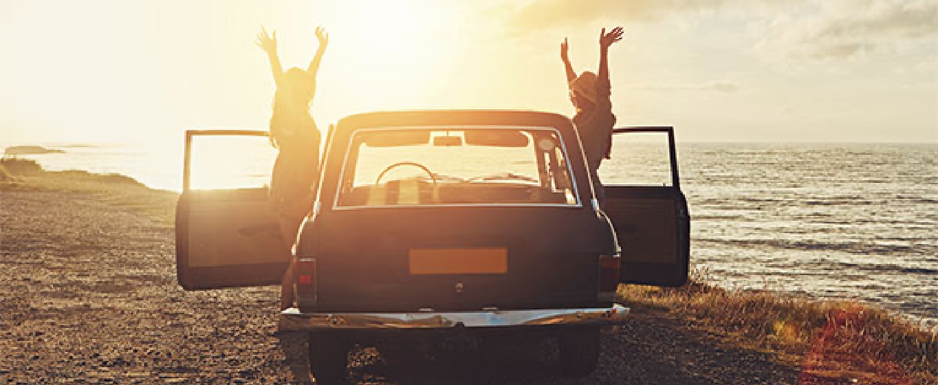 people with a car on the beach