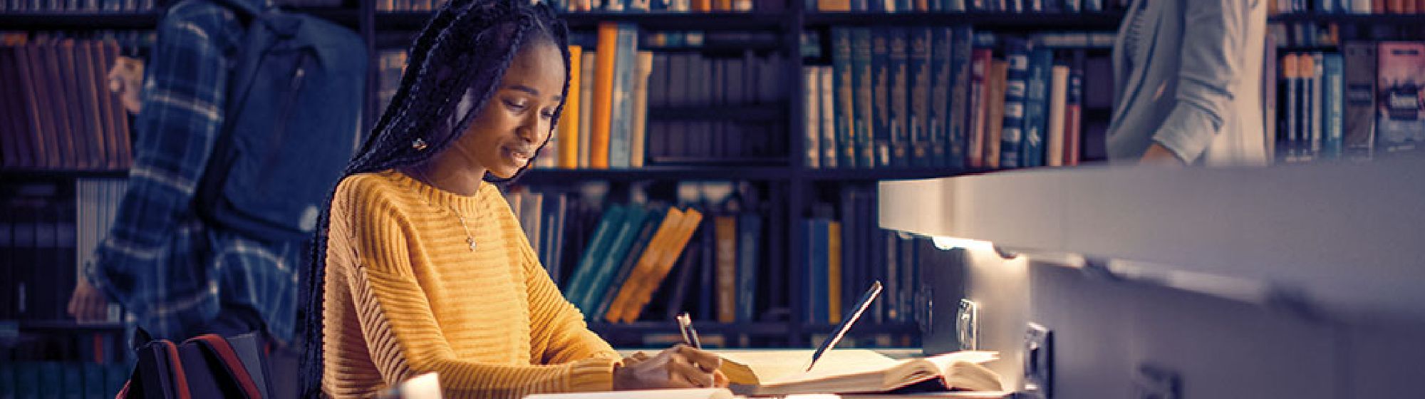 Female student studying in a library